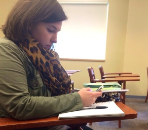 A W&L student stealthily texts during class. 